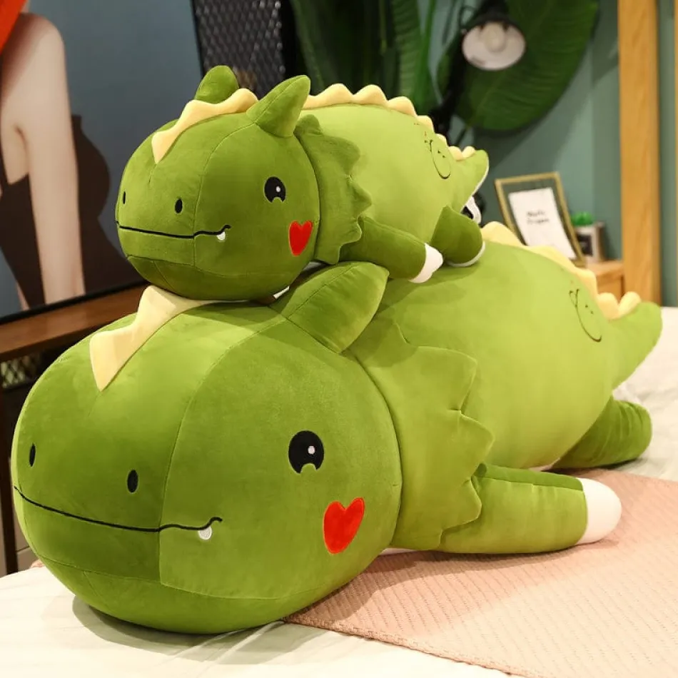 Discount La compagnie de la peluche Peluche dinosaure avec un cœur sur la joue