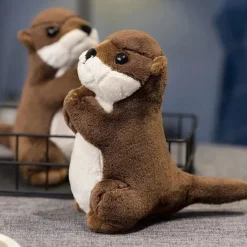 La compagnie de la peluche Peluche loutre aux mains jointes