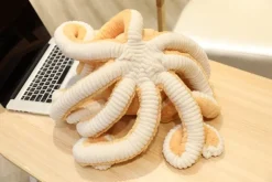 La compagnie de la peluche Peluche pieuvre contente et colorée