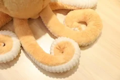 La compagnie de la peluche Peluche pieuvre contente et colorée