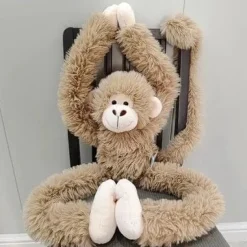 New La compagnie de la peluche Peluche singe à câlins