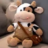 La compagnie de la peluche Peluche vache en salopette